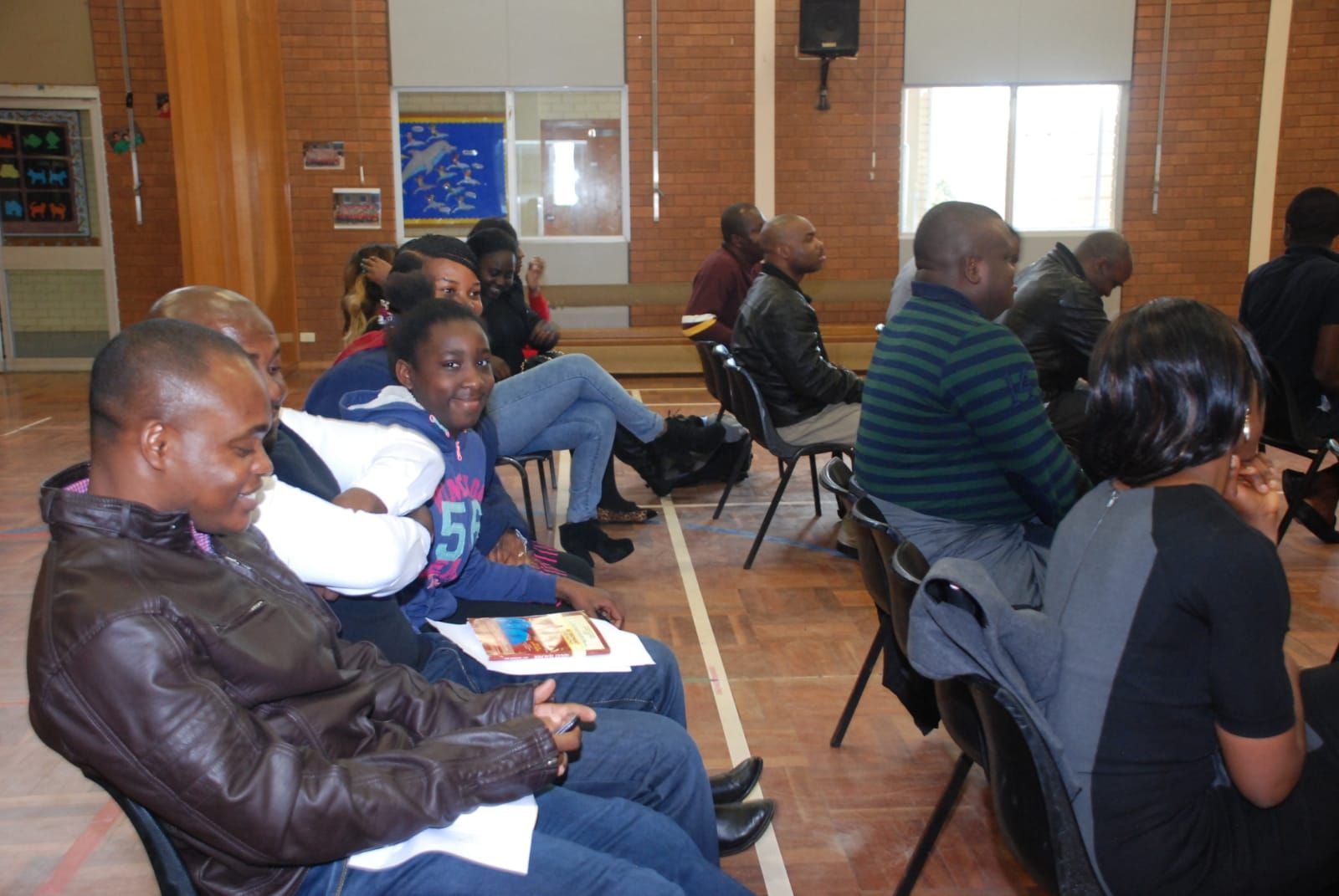 Church members seated together and listening during a service at Weston Community Hub